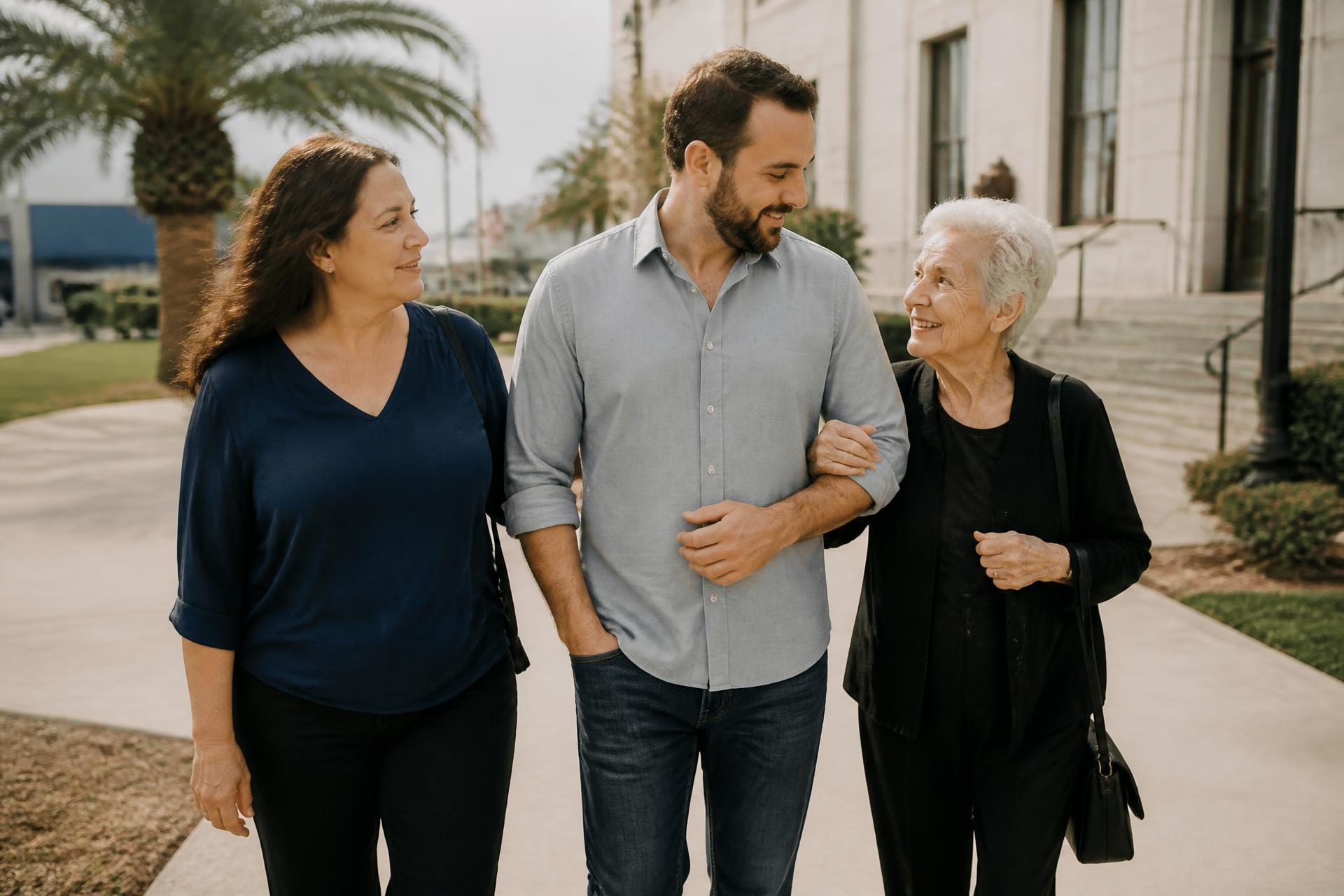 A mother, her adult son, and his grandmother walking together outside a Florida county courthouse